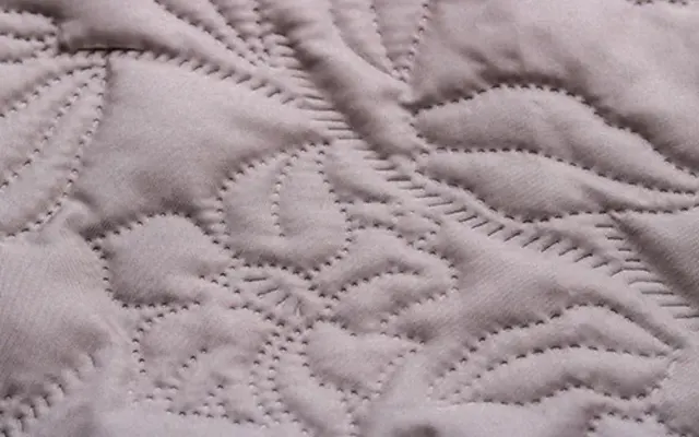 Quilted insulated fabric construction