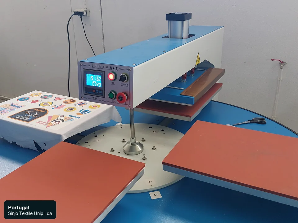 Heat-transfer press equipment beside visible printed transfer output at the Sinjo Textile Portugal operation