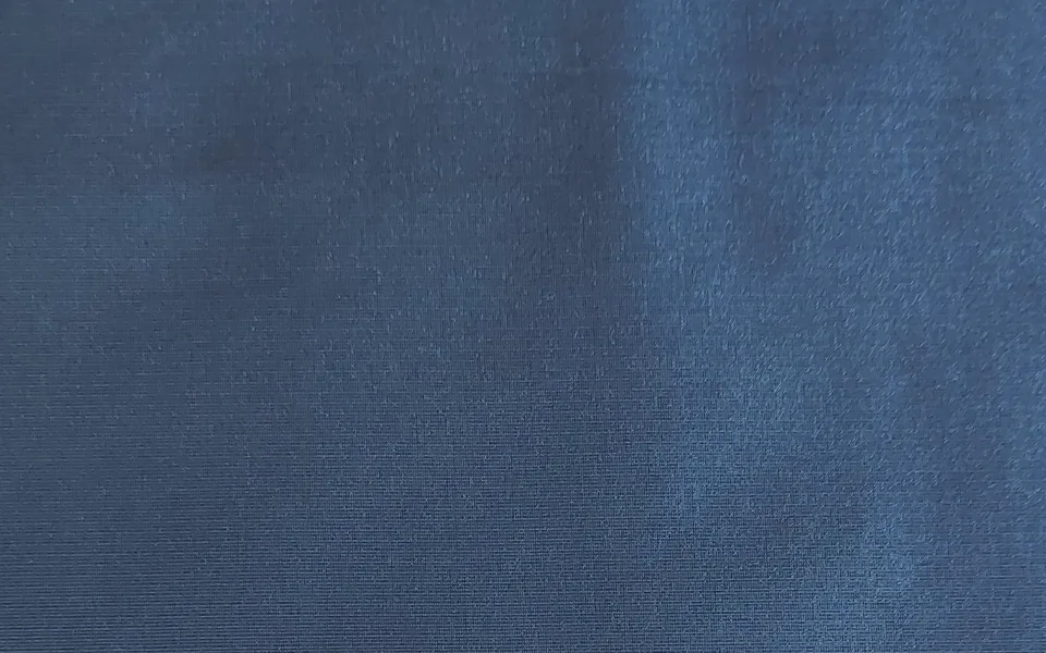 Blue fabric with a smooth finely textured surface