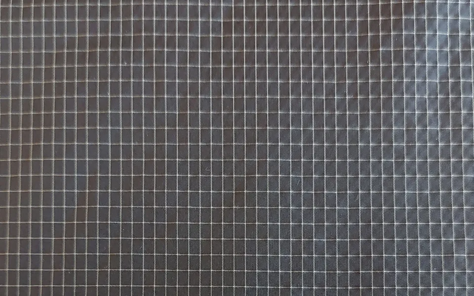 Charcoal woven fabric with a fine light checked pattern