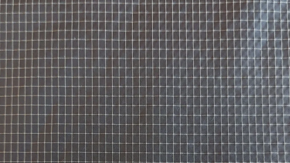 Charcoal woven fabric with a fine light checked pattern