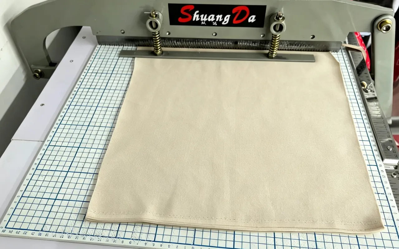 Fabric sample being prepared on a cutting table